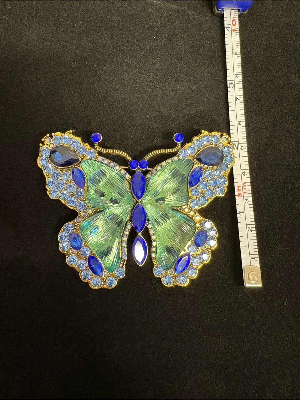 Large Blue, green, and goldtone butterfly brooch.